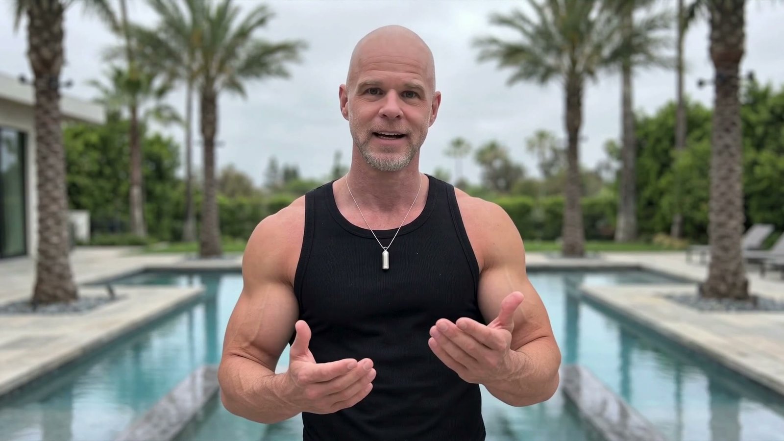 Chris Ciprian by the pool, speaking to camera